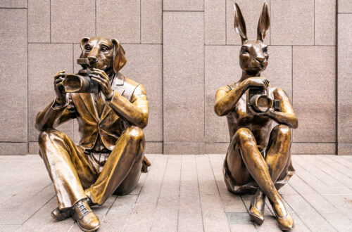 Paparazzi Dogman and Paparazzi Rabbitwoman. Bronze sculptures on Sixth Avenue in New York.